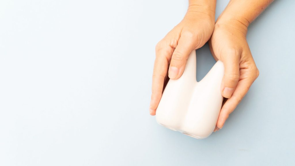 A person holding a white object.